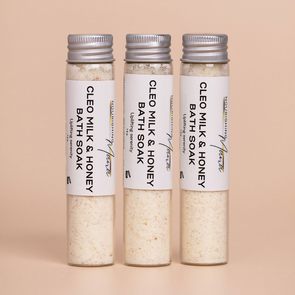 Three Cleo Milk & Honey Bath Soaks in reusable glass tubes by Nourishing Mana.