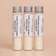 Three Cleo Milk & Honey Bath Soaks in reusable glass tubes by Nourishing Mana.